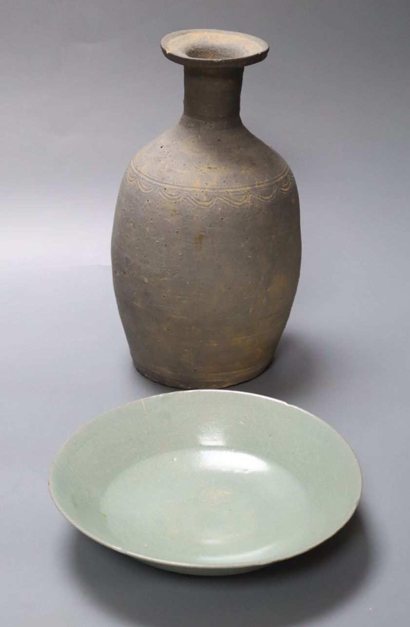 A Korean celadon saucer dish, Goryeo dynasty, 17cm and a Korean stoneware bottle vase, 23cm